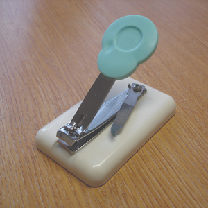 Table top finger nail clipper
