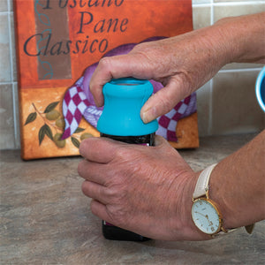 Pill bottle opener with magnifier