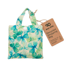 Eco-friendly foldaway shopper with storage pouch made from recycled bottles. Shamrock design