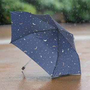 Eco-friendly super compact umbrella made from recycled plastic bottles. Moon and stars design