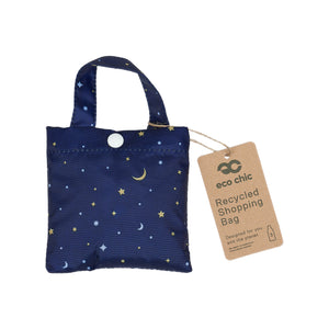 Eco-friendly foldaway shopper with storage pouch made from recycled bottles. Moon and stars design.