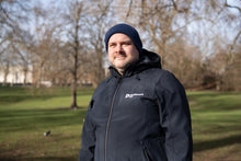 Parkinson's UK unisex sports soft shell jacket in navy made from 63 recycled bottles.