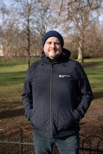 Parkinson's UK unisex sports soft shell jacket in navy made from 63 recycled bottles.